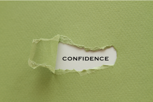 Confidence - word under ripped paper.png
